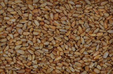 background of peeled roasted sunflower seeds in sugar glaze
