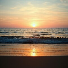 Sunset over the tranquil ocean with gentle waves lapping
