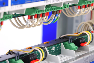 Connection of electrical modules using insulated mounting wires. Close-up. Soft focus.
