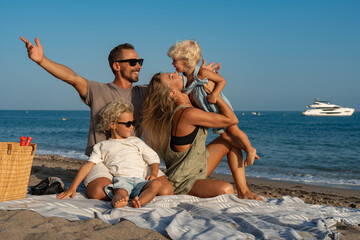 Family Enjoying Playful Moments on the Beach by the Sea