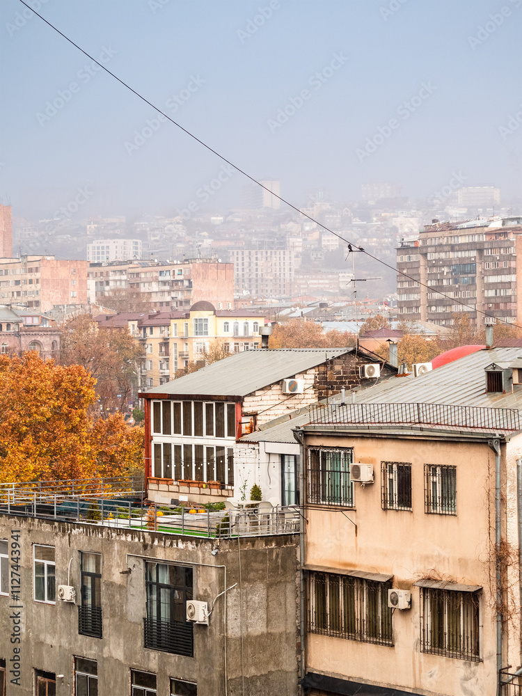 Sticker rain over apartment buildings in rainy autumn day