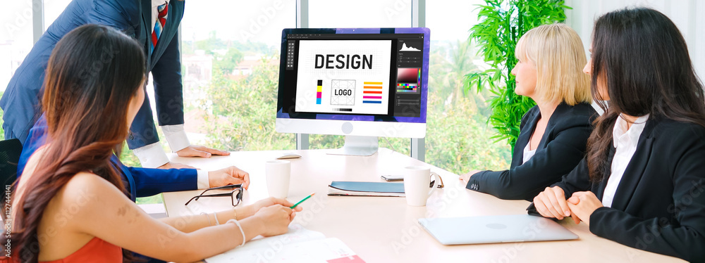 Wall mural graphic designer software for modern design of web page and commercial ads showing on the computer s