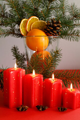 Christmas candles with festive decorations