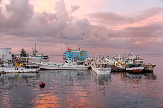 SUVA, FIJI - DECEMBER 2: Boats anchored at the port at sunrise on December 2, 2013 in Suva on Viti Levu, Fiji. Suva is political and administrative capital of Fiji.