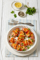 hot sausages baked with cheese, tomato, mustard