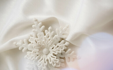 Minimalist Winter Decor: Snowflake on Draped Fabric