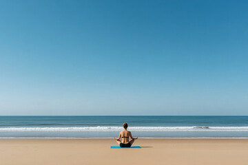 Fototapeta premium Meditation practice on the beach at sunrise