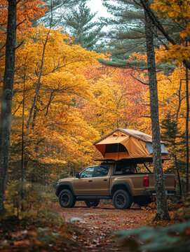 Overlanding adventure in autumn forest with roof tent on truck