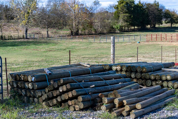 A pile of wooden post to build a fence