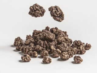 Obraz premium A dynamic showcase of granola with a mix of oats, nuts, and seeds. Set against a white background to produce a clean and appealing food photograph.