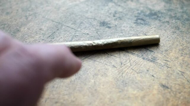 Close up of cannabis joint on grunge background