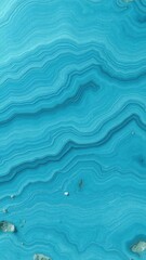 Obraz premium Light blue wave agate structure resembling rippling water, polished