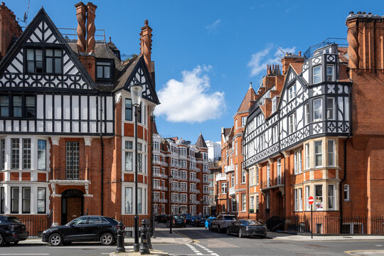 Red bricks houses on Hans Crescent street in Royal Borough of Kensington and Chelsea, London, UK