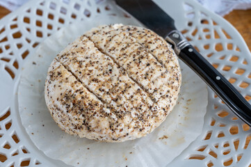 French fresh white soft goat cheeses with topping made with black pepper