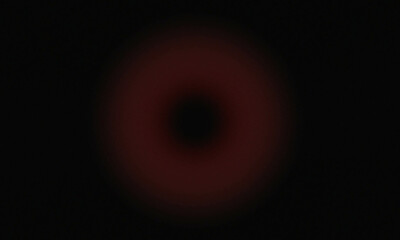 red circle grainy on black background dark 