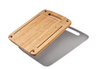 Wooden cutting board on white background