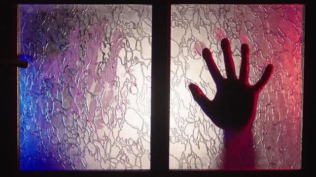 Terrifying Zombie Attack on Glass Door, Undead Hands Emerging from Blue Shadows into Blood-Red Light, Horror Movie Monster Scene