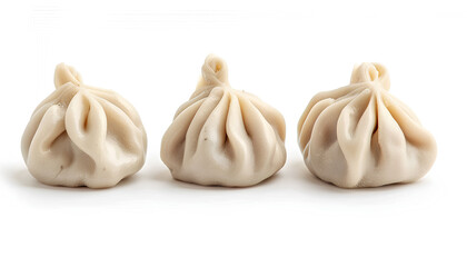 Obraz premium Uncooked khinkali (dumplings) isolated on white. Georgian cuisine