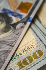 Obraz premium vertical photo, background, Close-up view of a 100 dollar bill with details, texture and vibrant colors. Perfect for finance, banking and wealth themes, vertical photo, wallpaper