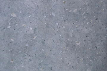 Speckled gray terrazzo surface in a continuous texture