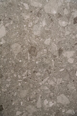 Gray terrazzo background with seamless speckled pattern