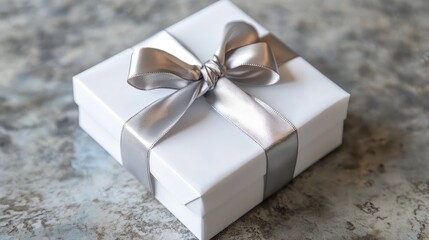 Elegant White Gift Box with Silver Ribbon on Textured Background