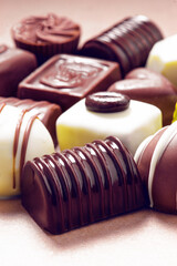 Gourmet Chocolate Pralines on Pink Background