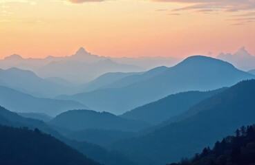 Layered mountain ranges at dawn. Gentle slopes of mountains painted in shades of blue. Soft light hues of sunrise. Nature scene. Calm morning light. Mountain views spectacular. Tranquil landscape.
