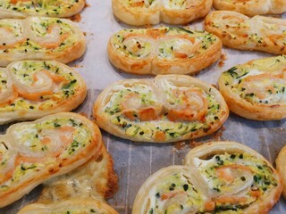 Home made baked savoury palmiers with smoked salmon