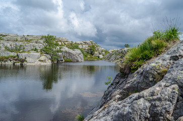 Fototapeta premium Mountain lake on the route to Preikestolen (The Pulpit Rock), a tourist attraction in Rogaland county, Norway