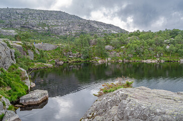 Fototapeta premium Mountain lake on the route to Preikestolen (The Pulpit Rock), a tourist attraction in Rogaland county, Norway