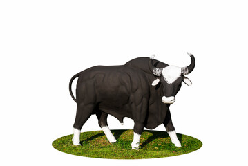 Black bull statue stands on grass isolated on white background.