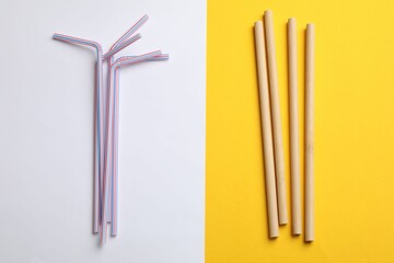 Different drinking straws on color background, flat lay