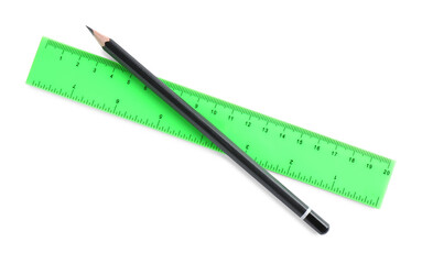 Ruler and pencil isolated on white, top view