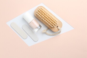 Pedicure procedure. Nail polish, files and brush on color background, flat lay