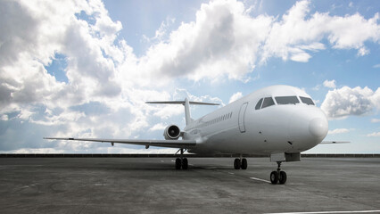 Commercial airplane on the runway with a blue sky background