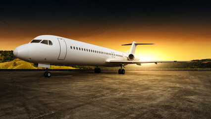 Commercial airplane on the runway with a sunset scene background