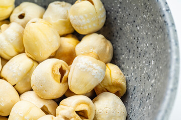 Closeup view of lotus seeds (Nelumbo nucifera) in the bowl