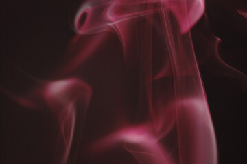 Obraz premium Close up of incense smoke as background. Smoke is the gaseous products of burning materials especially of organic origin made visible by the presence of small particles of carbon