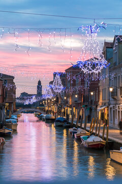 Canal at sunset with Christmas lights, Murano island, Venice, Italy