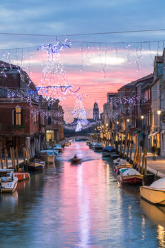 Canal at sunset with Christmas lights, Murano island, Venice, Italy