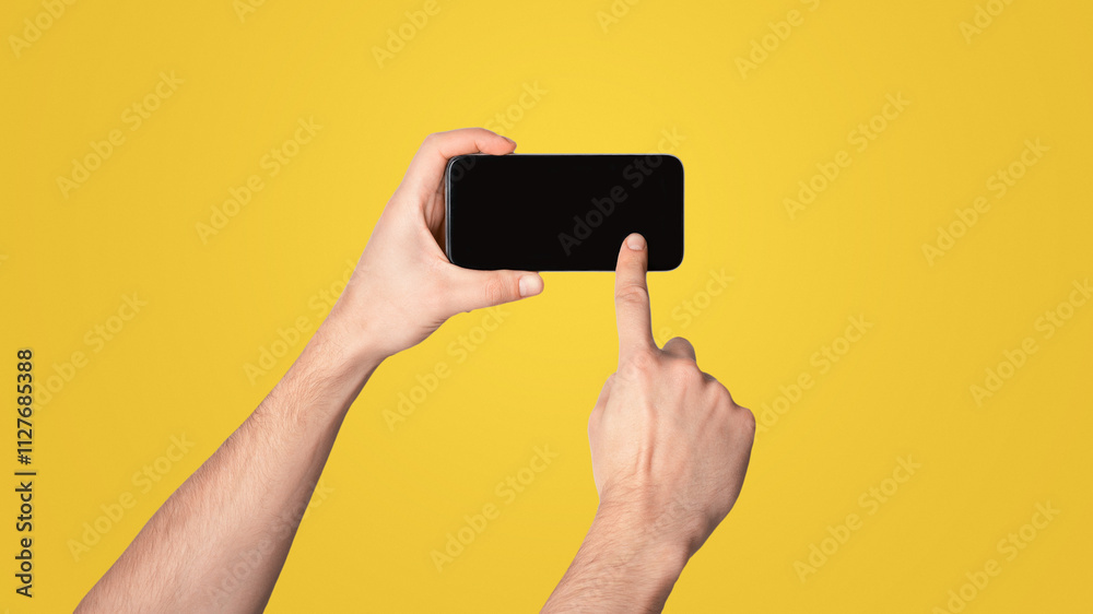 Aufkleber unrecognizable millennial guy touching screen of cellphone over light background, space for mobile a