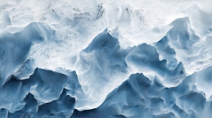 Obraz premium A close-up view of swirling blue ocean waves with white foam and intricate textures.