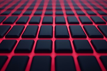 Obraz premium Close-up view of a textured surface made of black keys on a vibrant red background.