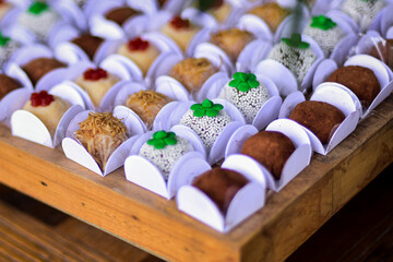 chocolate candies in a box, chocolate brigadeiro,  sweets, candy table, party sweets, candy balls, chocolate brigadeiro, white brigadeiro, brigadeiro, box of candies
