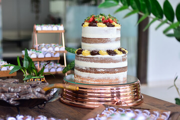 cake on a table, pool in the garden, birthday cake, 18th birthday, naked cake, two floors, layered cake, cake and sweets table, cake and sweets table
