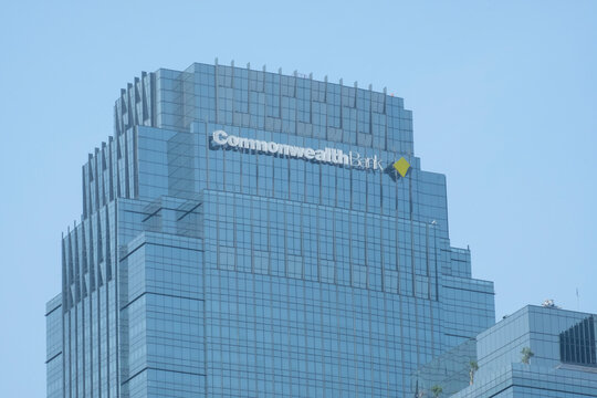 Jakarta, Indonesia - October 03, 2023 : Signage and logo type of Commonwealth Bank  brand on a glass wall on an office building.