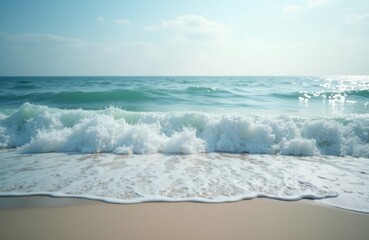 Tranquil beach scene shows gentle waves gently lapping on shore. Soft turquoise water meets soft beige sand. Perfect scene for relaxation, vacation. Blue water creates serene atmosphere. Peaceful