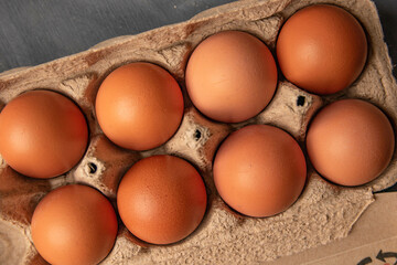 Brown organic eggs in a box