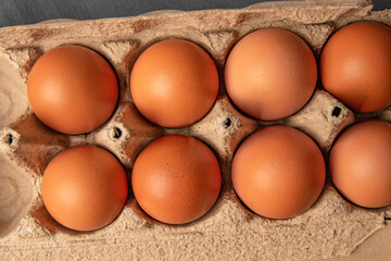 Brown organic eggs in a box